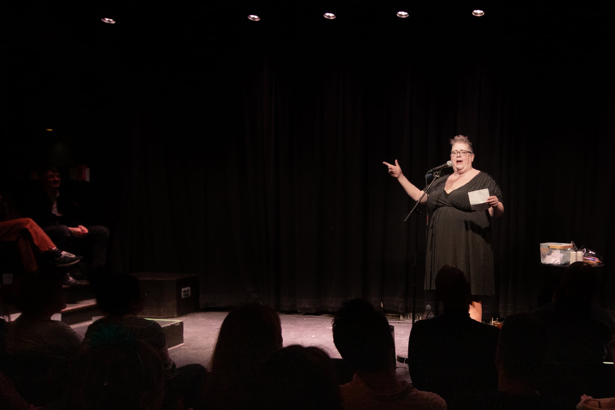 Smut Slam International founder Cameryn Moore on stage hosting the show, photo credit Jacob Stage